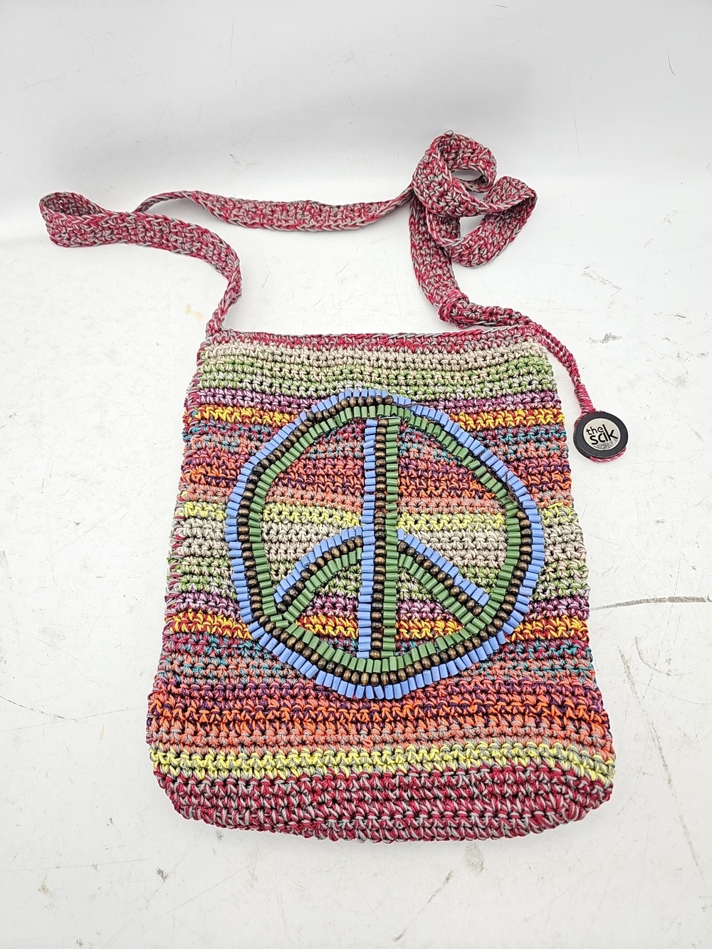The Sak Crochet Peace Sign Crossbody Bag